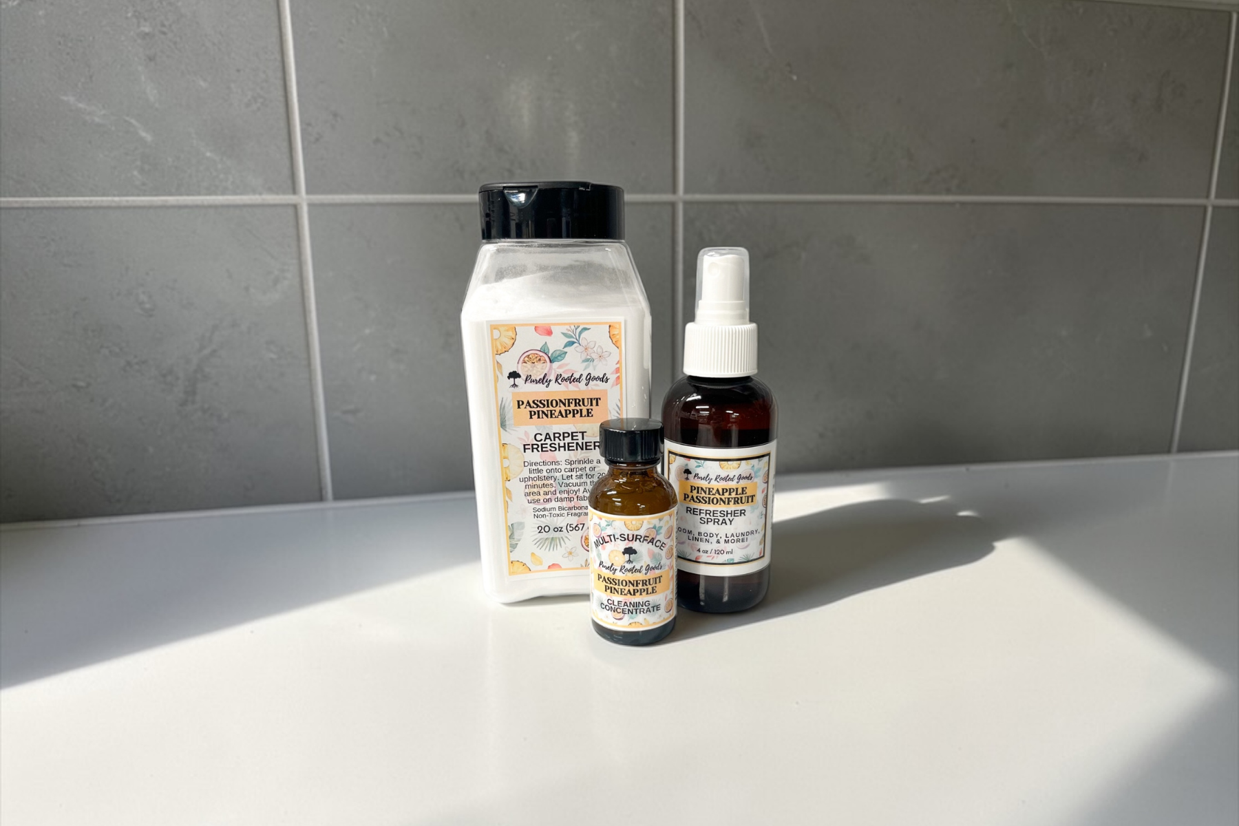 Non-toxic cleaning products including carpet freshener, refresher spray, and cleaning concentrate displayed on a clean white surface