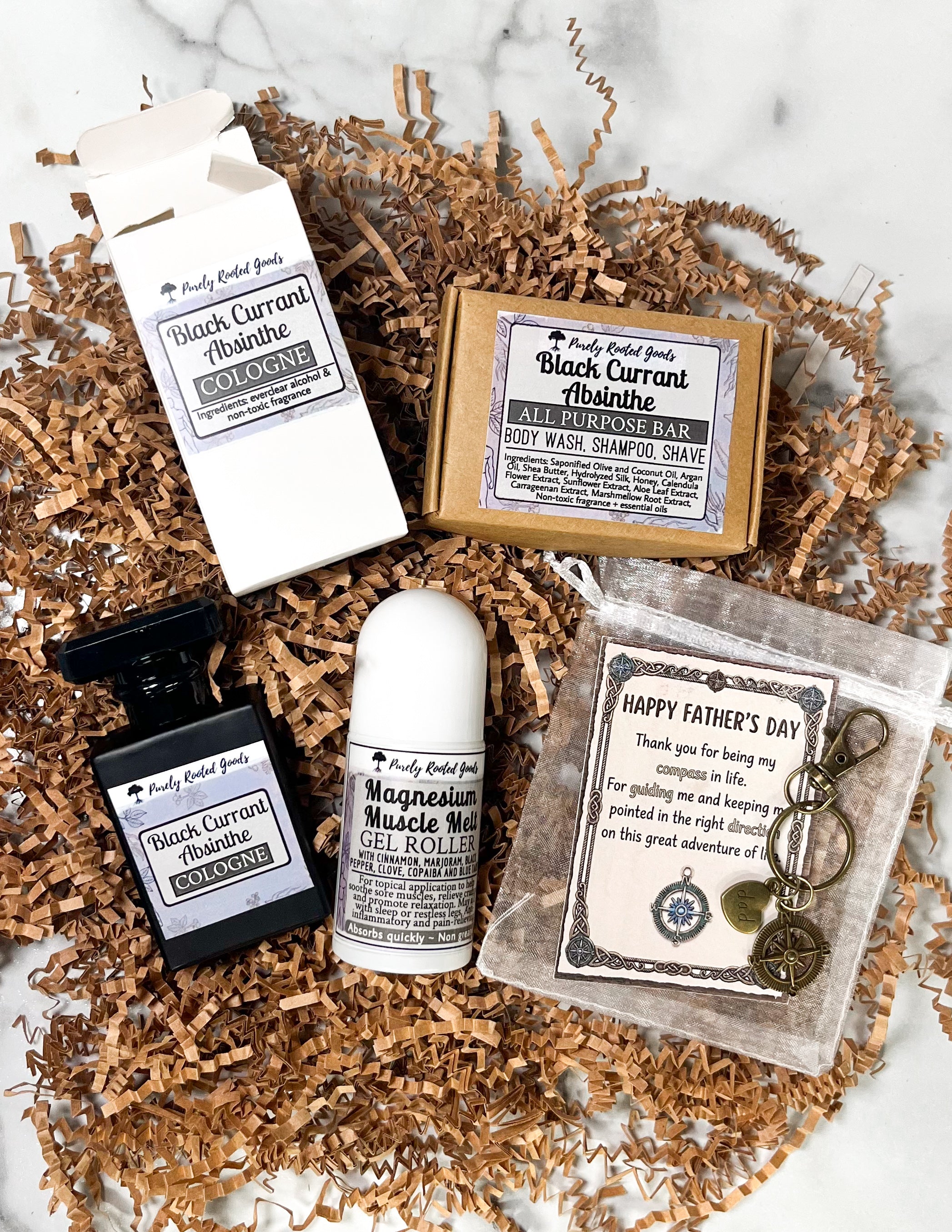 Collection of beauty products including a cologne, bar soap, gel roller, and keychain on a textured surface.